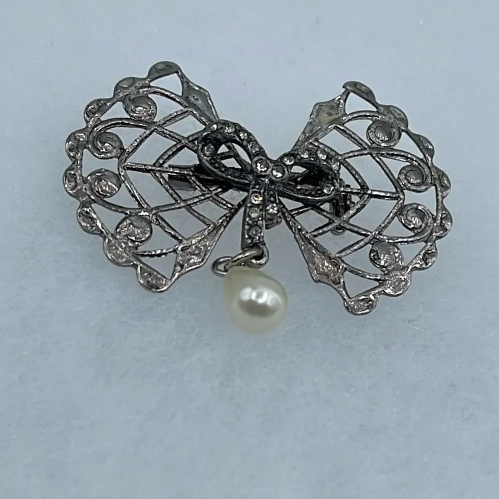 Vintage Bow & rhinestone ribbon with dangle faux pearl.